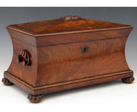 Mahogany sarcophagus tea caddy, the interior fitted with two lidded compartments and a central well with bowl, width 32cm.