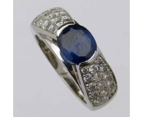 Sapphire and pave diamond 18ct gold ring, the oval mixed cut coloured stone approximately 1.5ct, indicated diamond weight 1.8