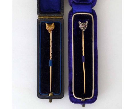 French gold, diamond and ruby fox head stick pin, 55mm in a Frazer & Haw from Garrards case; and another fox head stick pin w