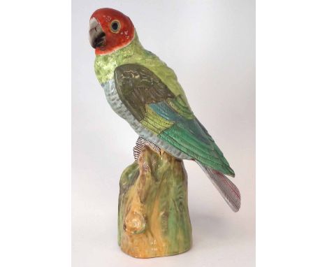 Staffordshire parakeet, modelled perched on a tree stump, impressed 'URIELA' to base, late 19th, early 20th century, 34cm hig