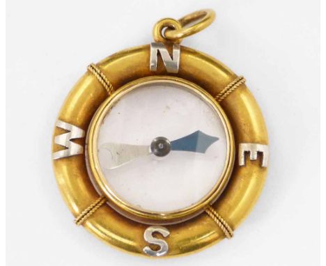 Unmarked compass fob modelled as a life belt, the cardinals lettered in white and yellow, diameter 28mm.
