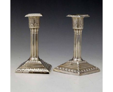 Pair of weighted silver Corinthian column squat candlesticks, Wm Hutton, London 1900,  height 14cm