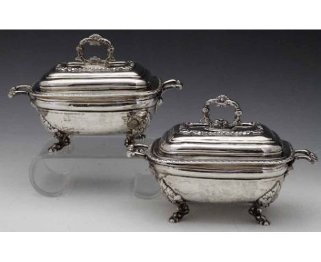 Pair of Irish silver sauce tureens and covers, Dublin 1821, maker's mark illegible, the rounded rectangular body with moulded