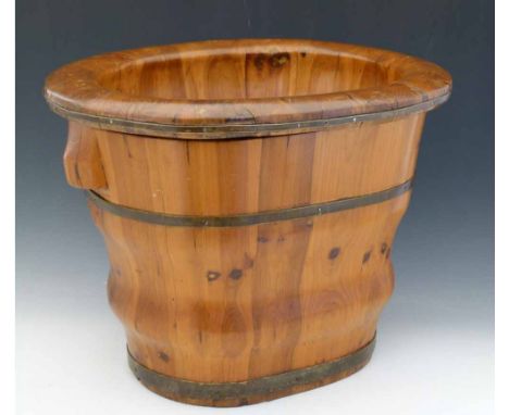 Chinese cedar coopered baby bath or basin on bucket stand, 20th century, width 53cm.
