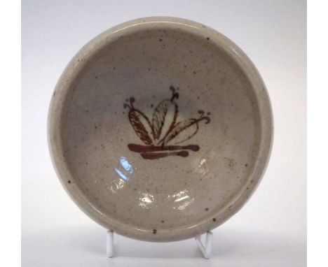 St Ives studio pottery small bowl attributed to Bernard Leach, painted with a flower head motif, impressed seal mark to foot,