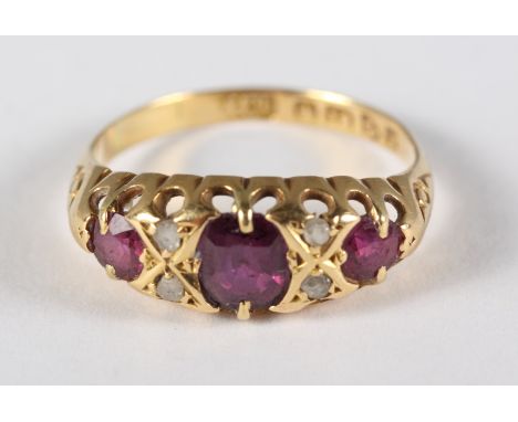 An Edwardian 18ct gold, ruby and diamond dress ring, size L