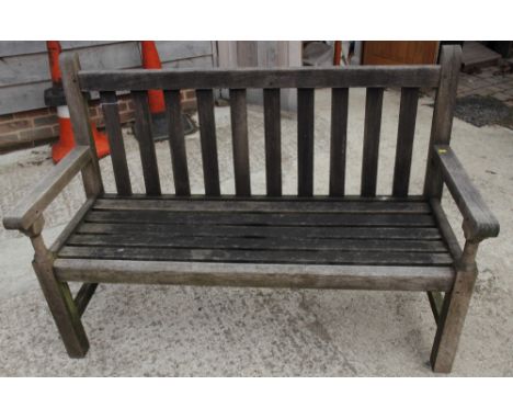 A slatted teak garden bench, 54" wide, and a rectangular slatted teak coffee table