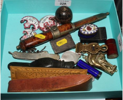 An assortment of miscellaneous items including a duck paper clip, a navy silver enamel lipstick holder, a Bilston enamel patc