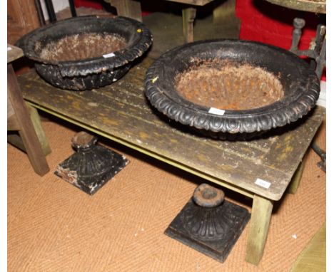 A pair of two-piece cast iron garden urns, painted black, 21" dia (damage to one rim)