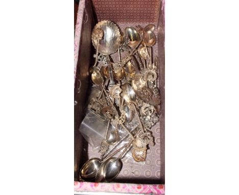 An assortment of Chinese white metal and other Chinese spoons together with an assortment of oriental silver coins