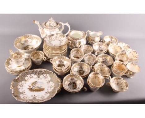 A 19th Century "Rockingham" style matched tea service decorated in grey and gilt (damages)