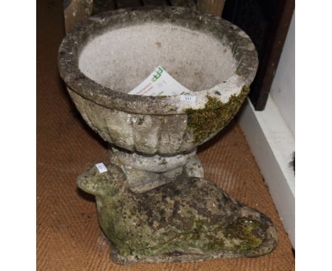 A weathered stone garden ornament of a seal and a shallow stone garden urn, 22" dia