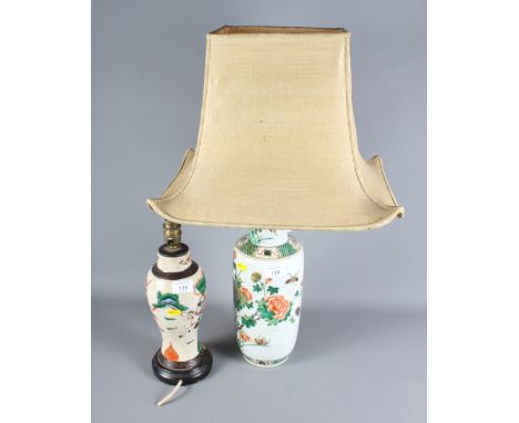 An oriental lamp base decorated in polychrome enamel and another pottery lamp base decorated with figures on horseback, the t
