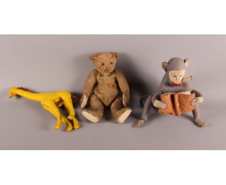 An early 20th Century Steiff teddy bear with replacement pads and much loved, 9 1/2" high, and two 1940s felt toys, monkey re