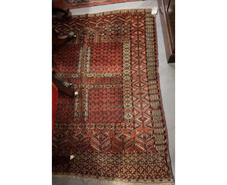 A Tekke Bokhara prayer rug decorated four panels with candlestick motifs, 55" x 48" approx