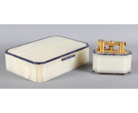 A Dunhill onyx and lapis lazuli table lighter, 3" high, with matching cigarette box, 7 1/2" wide