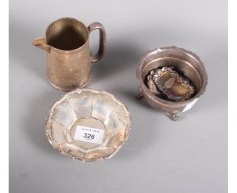 A silver christening mug (now converted to a jug), a silver sugar bowl, a silver bonbon dish and four silver decanter labels,