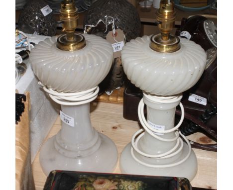 A pair of Victorian style white glass table lamp bases, 10" high (now converted to electricity)