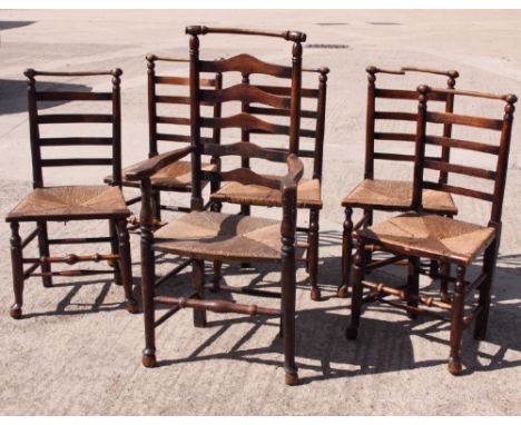 A set of five 19th Century rush seat ladder back dining chairs with decorative turned top rails (one damaged) and a similar c