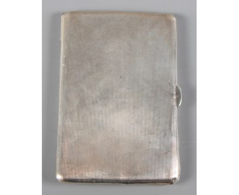 A silver cigarette case with engine turned decoration, 4.8oz troy approx