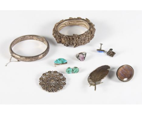 A filigree bangle decorated flowers, an engraved silver bangle, a turquoise brooch and earring set, a similar set of butterfl