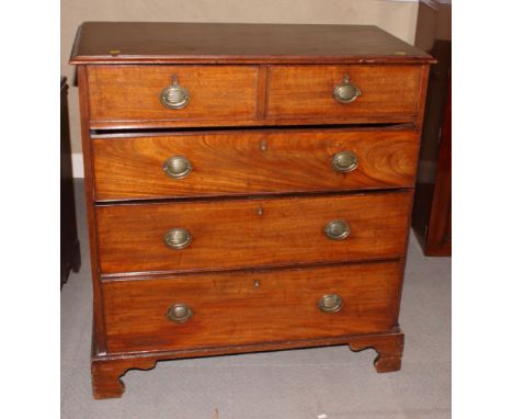 A 19th Century mahogany chest of two short and three long drawers with oval brass handles, on bracket supports, 37" wide
