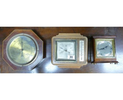 A Garrards of London clock, a Maskery and sons Tunstall oak cased wall hanging barometer, with another mahogany inlaid barome