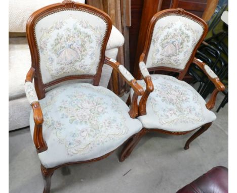 A pair of vintage French carved oak needle point armchairs with light green floral upholstery (2). 
