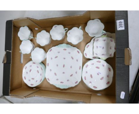 A collection of Shelley teaware in the Rosebud design to include serving plate, side plates, cups, saucers etc