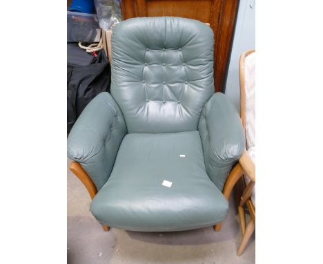 Mid-Century em Ercol armed in leather studded seating 