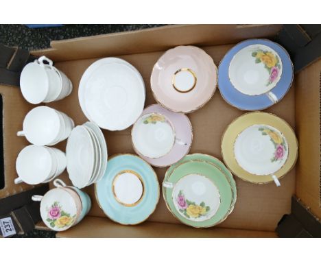 A mixed collection of ceramic items to include decorative Harleigh teacups and saucers and a quantity of undecorated similar 