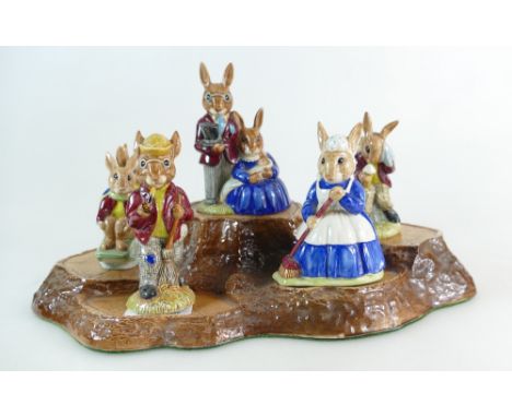 a collection of Royal Doulton Bunnykins figures comprising Autumn Days DB5, Family Photograph DB1, Sleigh Ride DB4, Clean Swe