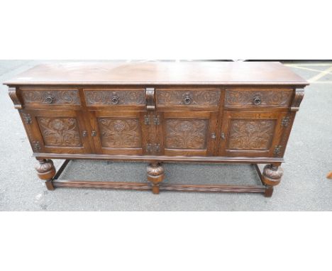 Priory style oak four draw and four door sideboard (key to be collected from the office)