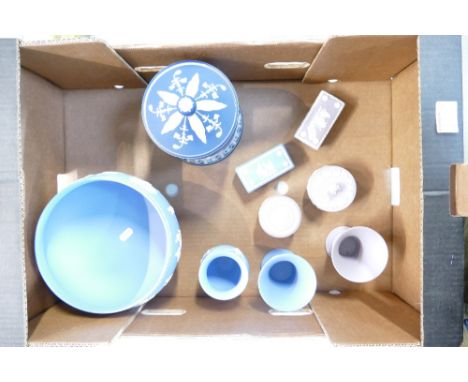 A collection of Wedgwood jasperware items including dark blue large jar & cover, large light blue egg bowl, lilac small trink