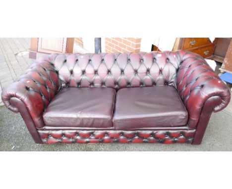 Red leather chesterfield type sofa bed settee