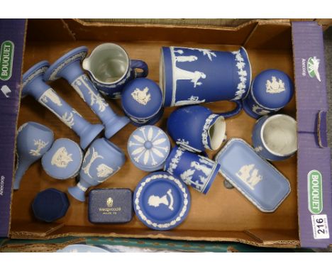 A collection of Wedgwood jasper ware in dark and light blue colouway to include candlesticks, jugs etc