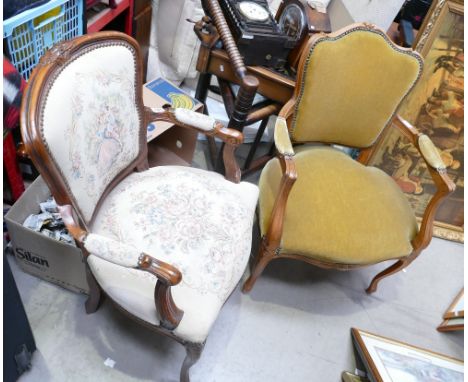 A vintage French carved oak needlepoint armchair with light green floral upholstery and similar chair in yellow upholstery. (