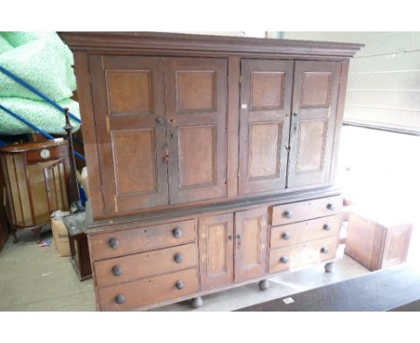 A Victorian Pine four door, six drawer housekeepers cupboard in original Scrumble finish.