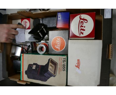 A collection of Leica items to include filters, Lunasix light meters and similar empty boxes and adapters