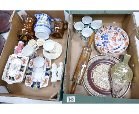 A mixed collection of ceramic items to include decorative water jugs, early ironstone floral decorated plates, Indian wood an