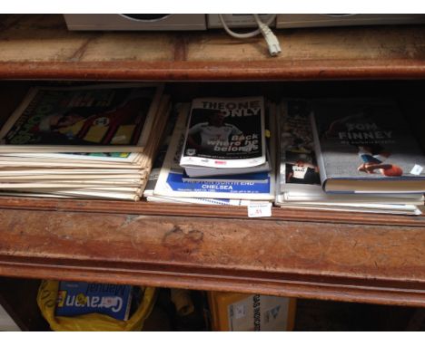 SHELF OF FOOTBALL BOOKS ETC AND SHOOT MAGAZINE