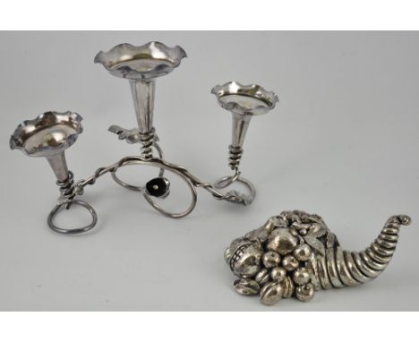 A silvered composite desk ornament modelled as a cornucopia, together with a chromed metal epergne of vineous form (2)