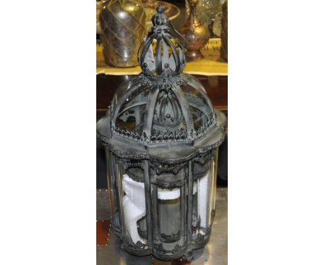 One large octagonal lantern together with another smaller octagonal lantern, the largest measuring H:66cm