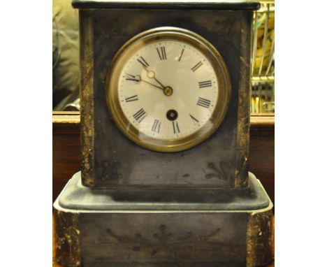 A late Victorian black slate mantel clock