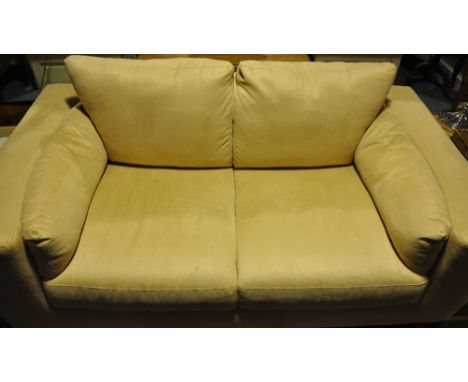 A modern faux suede two seater sofa