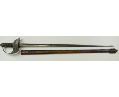 Sword Victorian 1897 pattern infantry officers with nice clean blade some wear to grip in its brown leather field scabbard