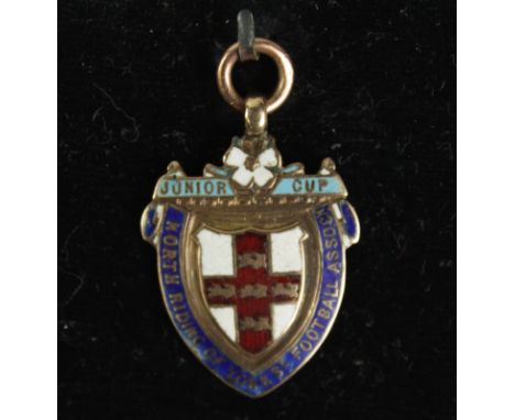 North Riding 9ct Gold hallmarked Medal. Weight 7 grams. Gold with enamel crest and legend to front engraved. "1908 Oliver Att