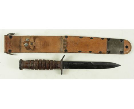 US M3 Camillus 1943 dagger with brown leather scabbard marked 'US. M6 Milsco 1943'.  Scarce