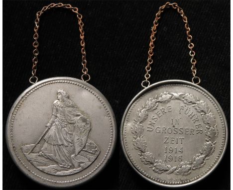German WW1 pewter medal contains 26 lithographs of Generals etc inside the medal. The medal has 2 eylets and chain - very unu