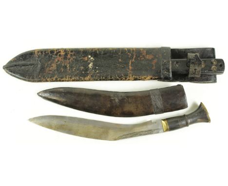 Knives: 1) Kukri blade 13".  In its steel leather scabbard generally good condition. Early 20th century?  2) Machete by Marti